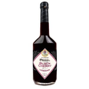 A bottle of alcohol with the label " powell 's black cherry ".